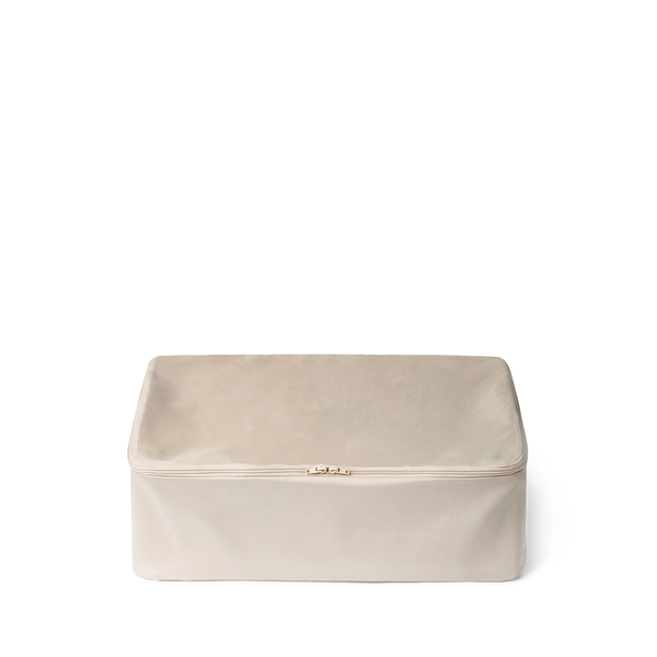 Small beige packing cube for suitcase
