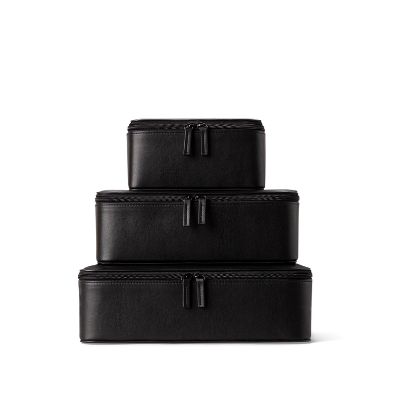 The front of our vegan packing cubes on top of each other in black