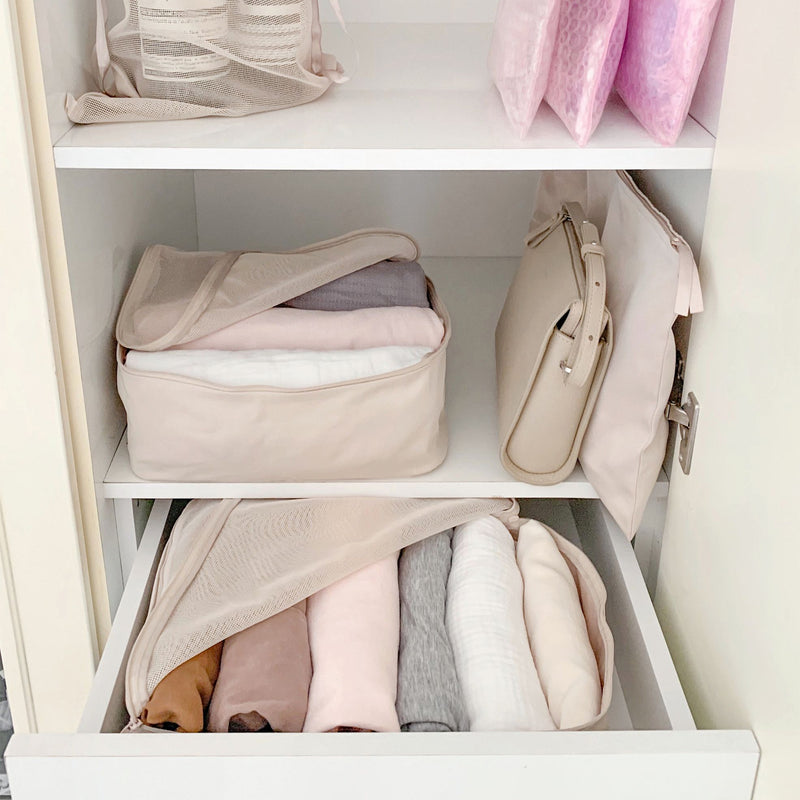 packing cubes showing you how to use them in a wardrobe while traveling