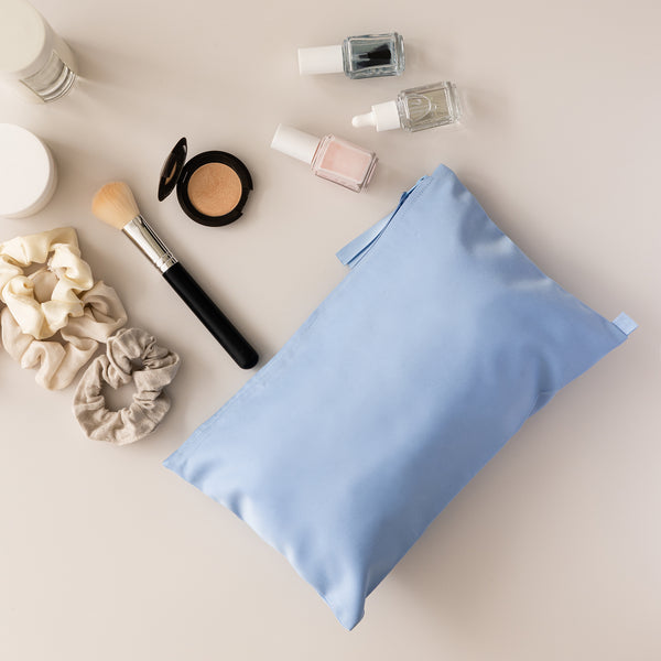 blue beauty bag with make up.
